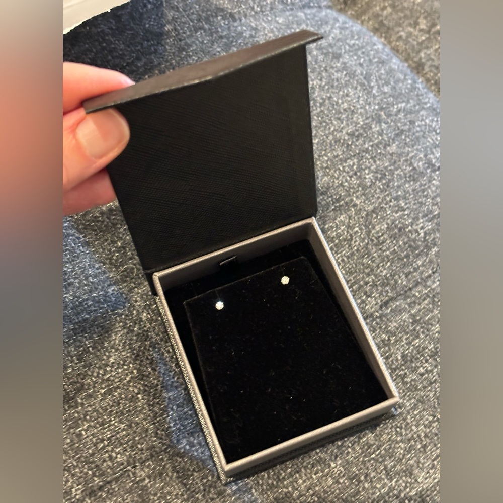 14 carat white gold earrings, .13 carat weight moissanite stones. New with box